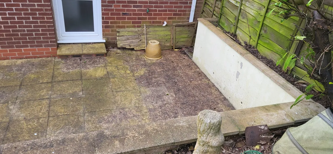Before: Green, slippery slabs cleaned back to their original colour.